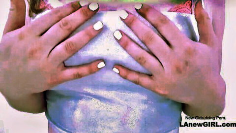 Busty babe with white nails squeezing her big tits in shiny top teasing cleavage