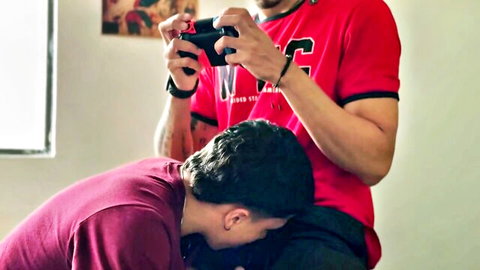 Latino gamer getting boxer blowjob from kneeling guy, amateur gay oral