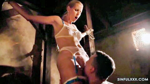 Blonde in white lingerie bound and receiving intense oral sex from man