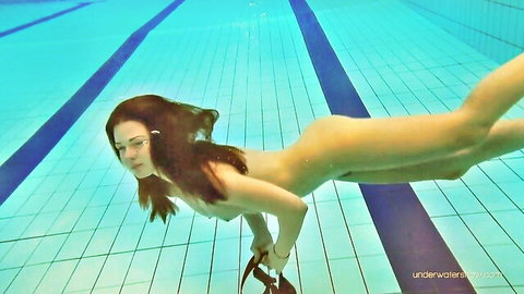Redhead teen nude underwater, legs spread showing nice ass and pussy closeup