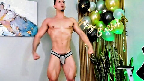 Hot young muscular guy flexing in grey underwear birthday pose