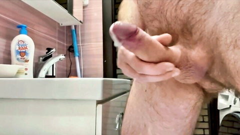 Hairy guy with big cock cums hard in close-up handjob view