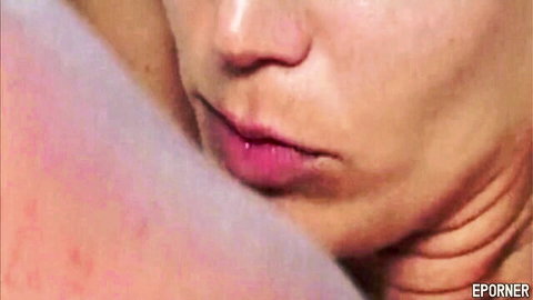 Seductive close-up of blonde model Blondie Anderson's glossy lips and neck