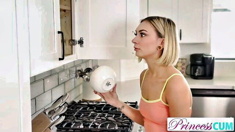 Chloe Temple in pink crop top holding white cum bowl, teasing in kitchen