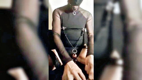 Kinky BDSM masochist in sheer harness enduring CBT electro torture solo