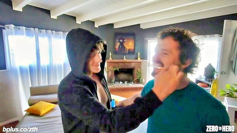 Busty babe in open hoodie exposes huge tits grabbing bearded man's chin intimately