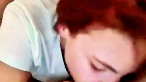 Redhead babe eyes closed moaning in intense ecstasy wearing tight shirt