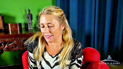 Excited blonde MILF in zebra top teases with cleavage before solo fingering