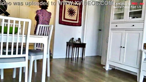 Skinny brunette MILF in purple top shows small ass from behind in office