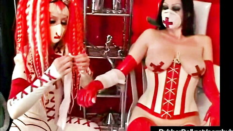 Rubberdoll in red latex nurse outfit bandaging partner, succubus fetish with dental tools