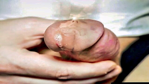Close-up handjob cumshot on erect penis