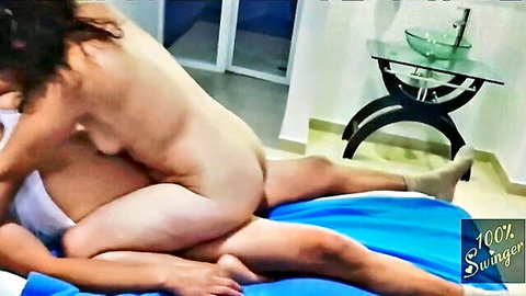 Nude Mexican woman riding man in cowgirl position during swinger session