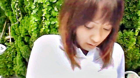 Japanese cutie in white shirt poolside, shy gaze