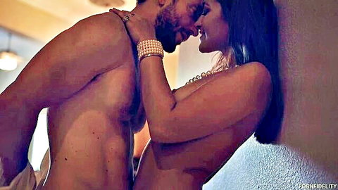 Dani Daniels nude passionate embrace with muscular bearded man against wall