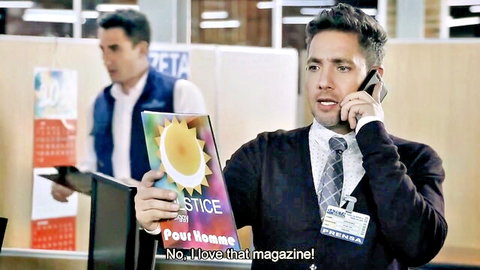 Camy Jiménez Infieles S01E01 office scene with men and Pour Hommes magazine