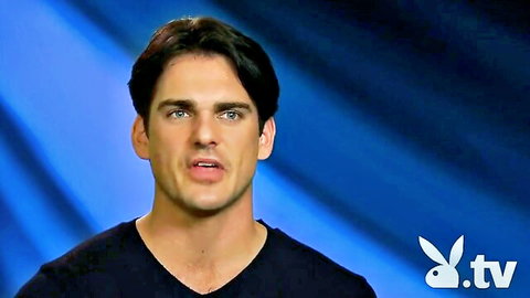 Handsome dark-haired man in black v-neck on Playboy TV The Man S1E6