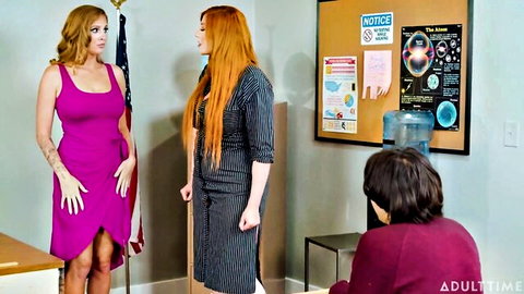 Two mature women in dresses with young guy in classroom threesome