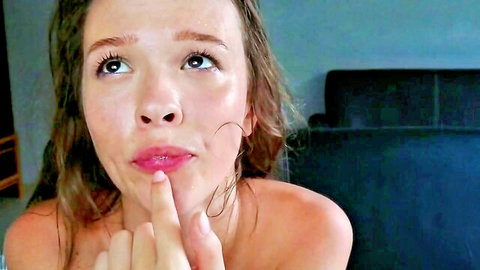 Topless freckled beauty seductively touches plump lips with finger