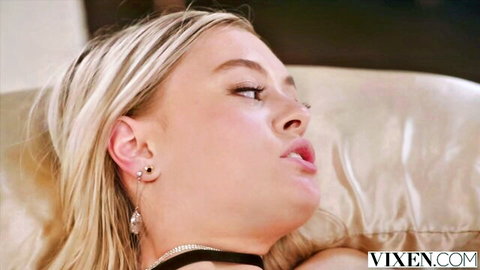 Innocent blonde Amber seduces in Vixen video, close-up seductive gaze
