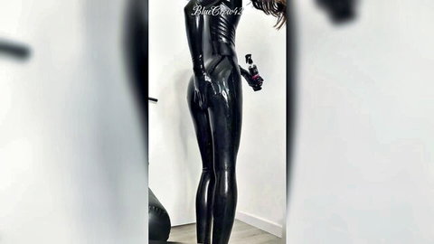 Femboy in shiny ebony latex catsuit posing and polishing seductively