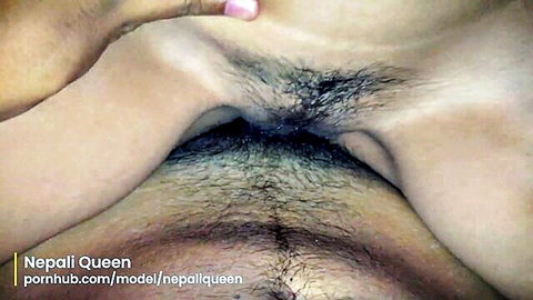 Nepali woman spreads her bushy hairy pussy wide open revealing pink labia