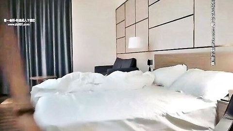 Asian woman teasing in bed, mysterious JAV hotel scene