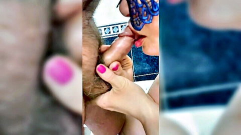 Masked woman with pink nails sucking thick black cock closeup blowjob