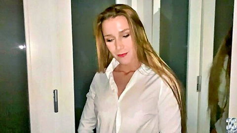 Blonde teen in unbuttoned white shirt teasing deep cleavage with small natural tits