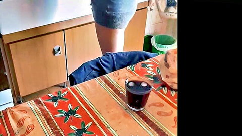 Sexy cleaning lady in short skirt pauses dishwashing for kitchen fun