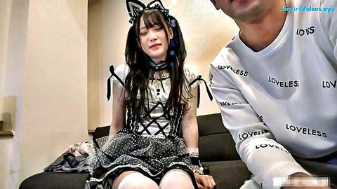 Miss Akihara in cat ear cosplay lingerie sitting with partner on couch