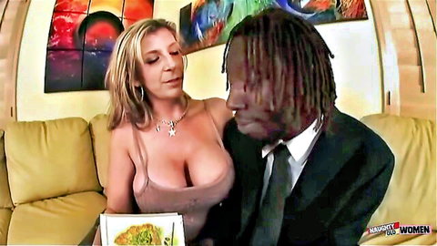 Blonde big tits woman in tight dress teases suited black man with food