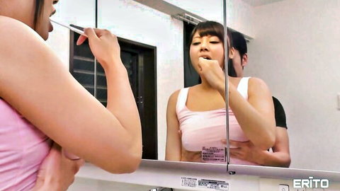 Erena's H-cup breasts strain pink tank top while brushing teeth sensually