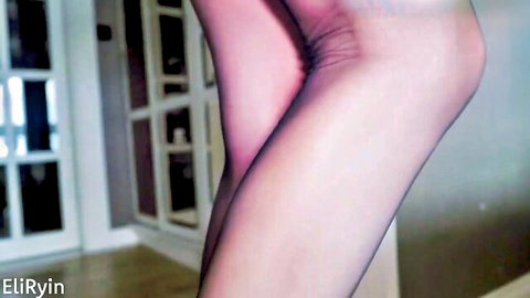 Ebony domina in sheer nylons and high heels bending over teasing