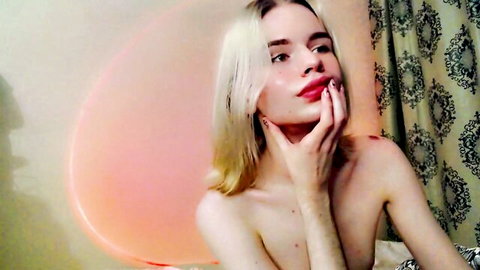 Temberli cute blonde trans nude pose, hand on face