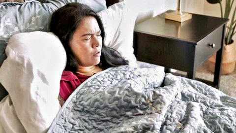 Kylie Rocket distressed on bed in adult video with Tommy Pistol