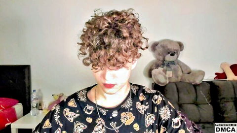 Curly-haired 18-year-old gay boy in patterned top, teasing solo