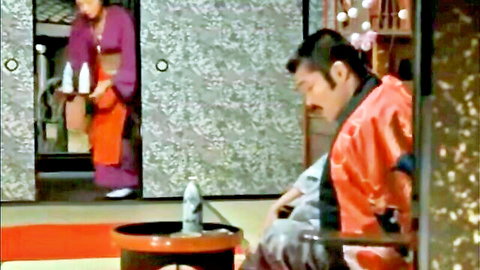 Japanese couple in kimonos sharing intimate moment in erotic film scene