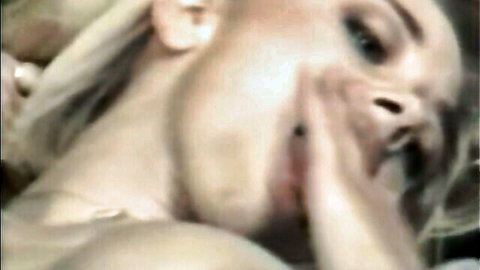Close-up of blonde woman's ecstatic face in vintage anal gaping porn