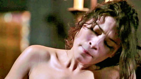 Ecstatic curly brunette babe topless with open mouth in orgasmic pleasure closeup