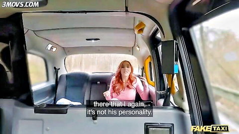 Redhead woman in pink top chatting in back of Fake Taxi cab POV
