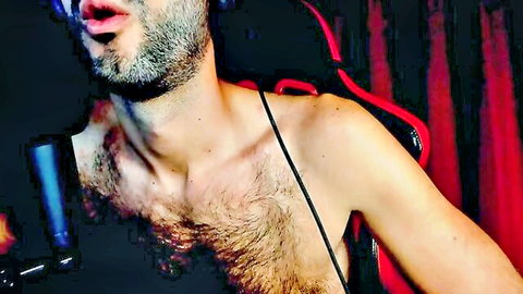 Shirtless hairy bearded young man with open mouth teasing in dark gaming chair