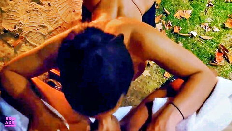 Sissy and woman resting nude in nature, outdoor lesbian embrace