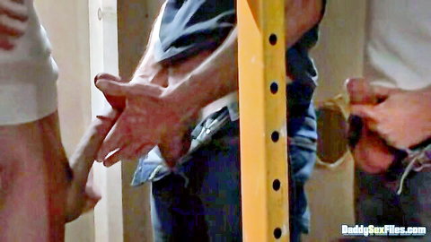 Three white men in jeans pull down for steamy gay handjob threesome