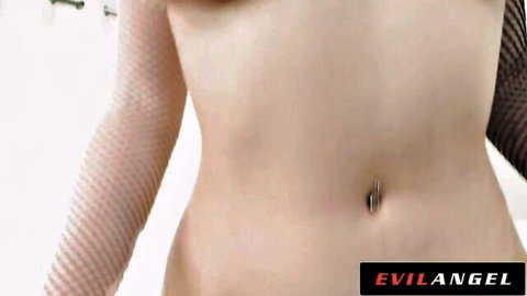 Alyx Star curvy topless pose with fishnet sleeves and navel piercing