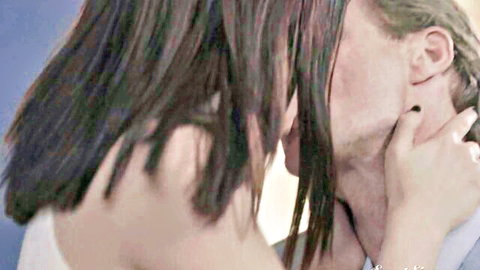 Petite brunette passionately kissing older man's neck in intense straight makeout