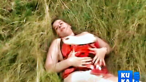 Curvy BBW brunette with huge tits exposed and shaved pussy visible lying on grass outdoors
