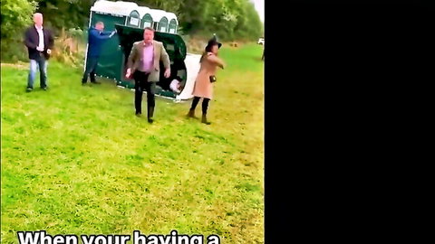 Outdoor porta-potty catch with surprised woman in coat and man exiting