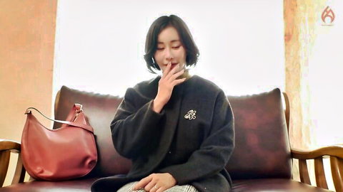 Elegant Asian MILF in dark coat, mature beauty sitting pensively, JAV thumbnail