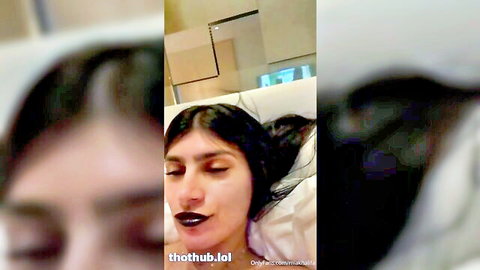 Mia Khalifa nude in hotel room, lying seductively on bed