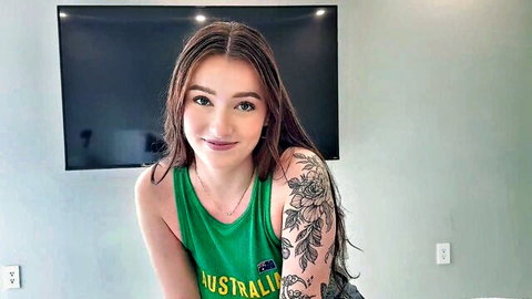 Jade Harper big tits stepsis smiling in green Australia tank top with tattoos